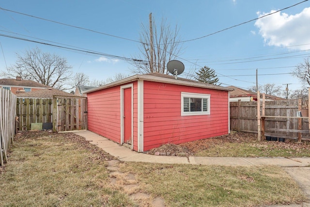 view of outbuilding featuring a yard