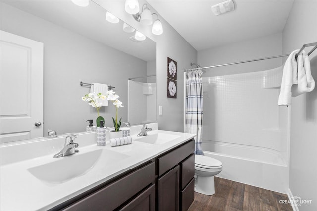 full bathroom featuring shower / tub combo with curtain, wood-type flooring, toilet, and vanity