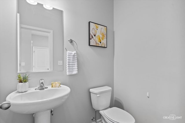 bathroom with sink and toilet