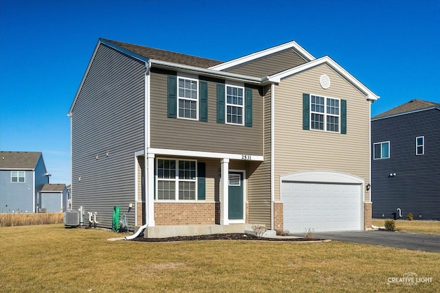 view of front of house with a garage, central AC, and a front lawn