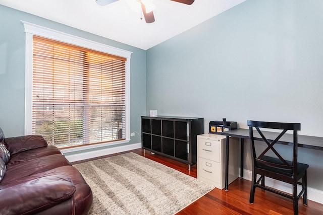 office space featuring dark wood-type flooring and ceiling fan