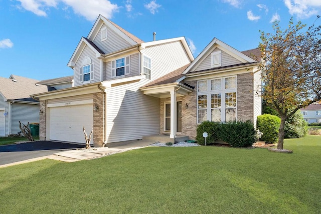 view of front of property with a garage and a front lawn