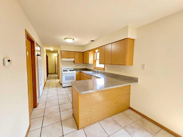 kitchen featuring kitchen peninsula, sink, gas range gas stove, and light tile patterned floors