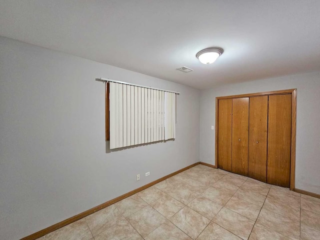 unfurnished bedroom with a closet