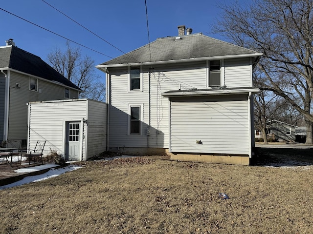 back of property featuring a lawn