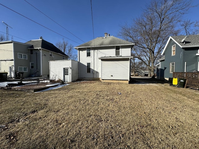 back of property featuring a yard and a patio area