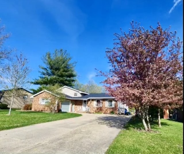 single story home with a garage and a front yard