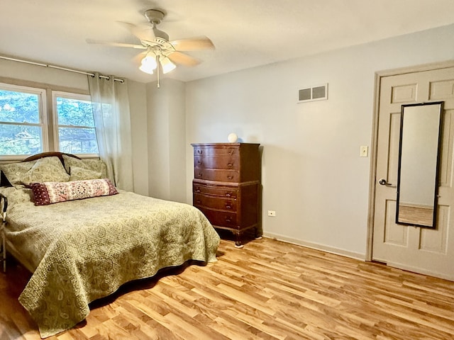 bedroom with hardwood / wood-style flooring and ceiling fan