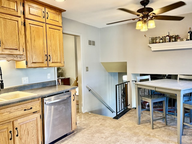 kitchen featuring dishwasher, sink, and ceiling fan