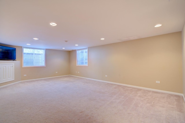 interior space with recessed lighting, baseboards, and light colored carpet