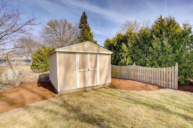 view of shed with fence