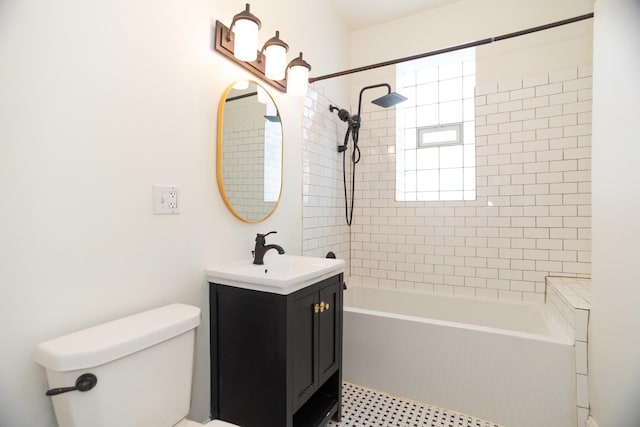 full bathroom with toilet, vanity, and shower / tub combination