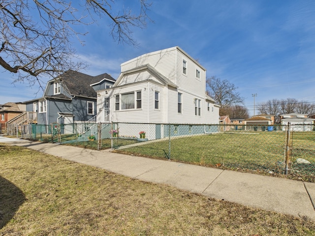 view of property exterior with a yard, fence, and a residential view