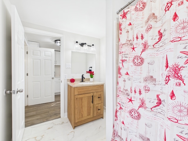 full bathroom featuring vanity, curtained shower, and marble finish floor