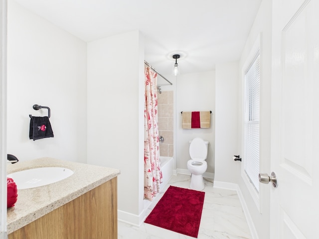 full bath with vanity, baseboards, shower / bath combo with shower curtain, toilet, and marble finish floor