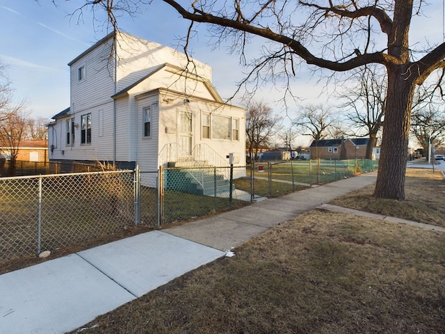 view of side of property with a lawn