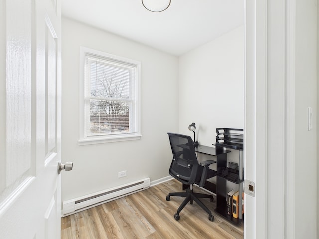 office with light wood-type flooring, a baseboard radiator, and baseboards