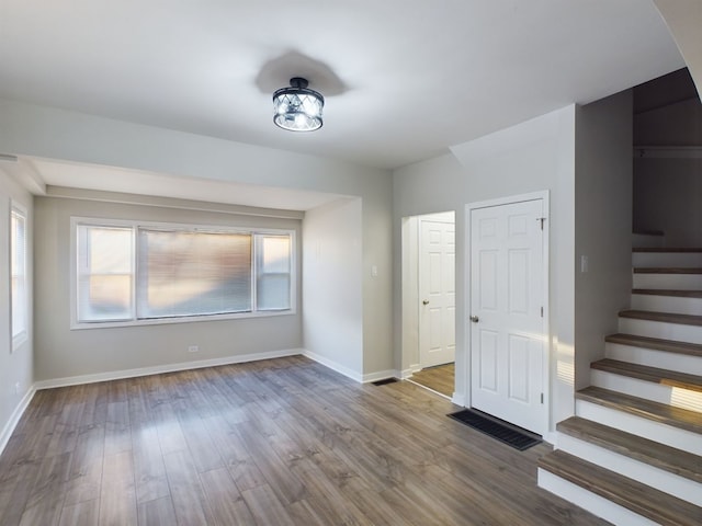 spare room with hardwood / wood-style floors