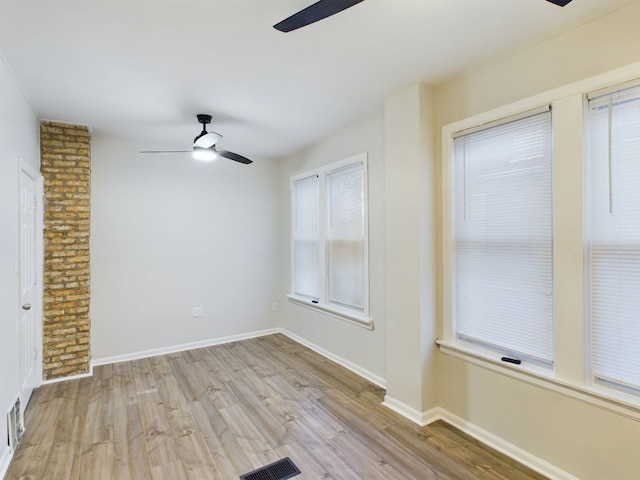 spare room featuring ceiling fan and light wood-type flooring