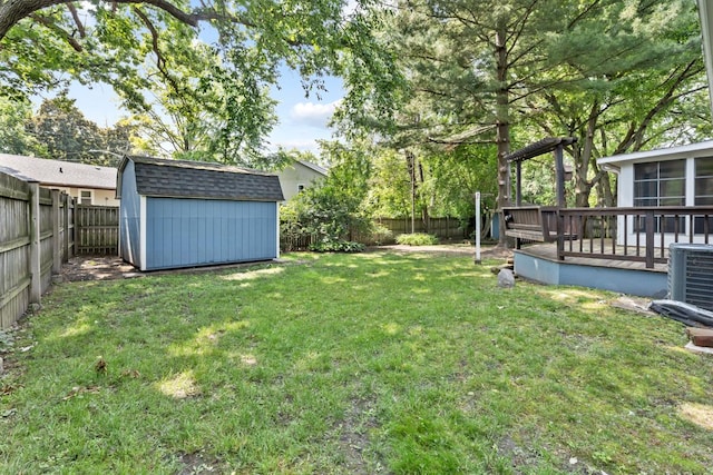 665 S Circle Ave, Port Barrington, IL 60010 - fenced backyard with a storage shed, a deck, and a sunroom