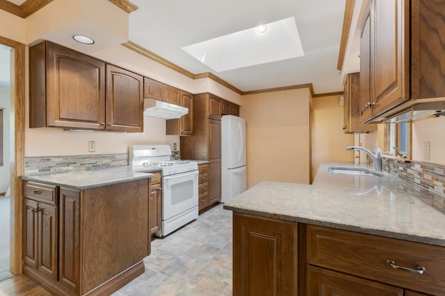 665 S Circle Ave, Port Barrington, IL 60010 - kitchen with white appliances, a skylight, under cabinet range hood, backsplash, and crown molding