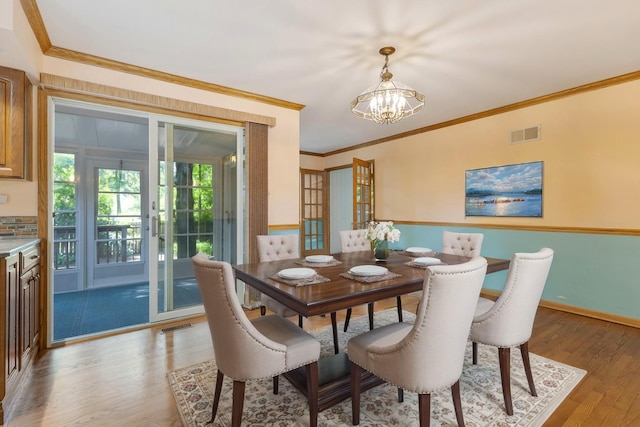 665 S Circle Ave, Port Barrington, IL 60010 - dining room with a chandelier, light wood-type flooring, and crown molding