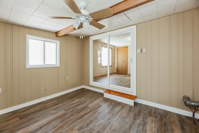 spare room with ceiling fan and dark hardwood / wood-style floors