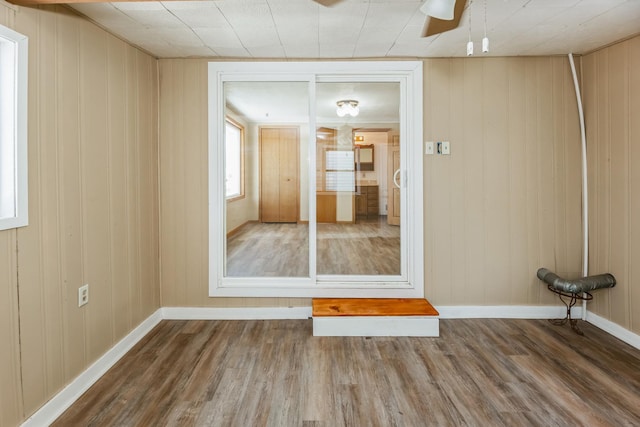 spare room featuring hardwood / wood-style floors and ceiling fan