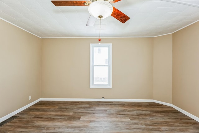 unfurnished room featuring hardwood / wood-style flooring, ornamental molding, and ceiling fan