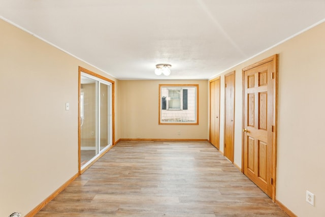 spare room featuring light hardwood / wood-style flooring