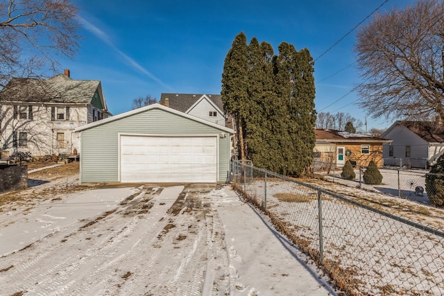 view of front of property with a garage and an outdoor structure