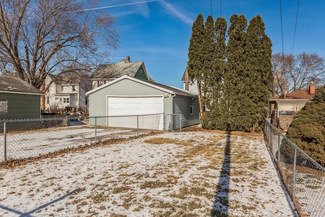 view of snow covered exterior with a garage