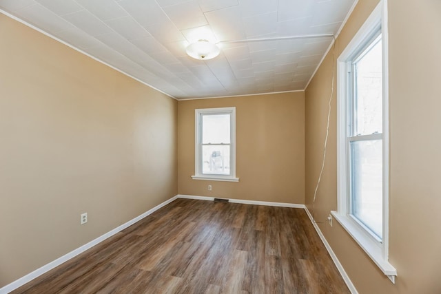 spare room featuring hardwood / wood-style floors