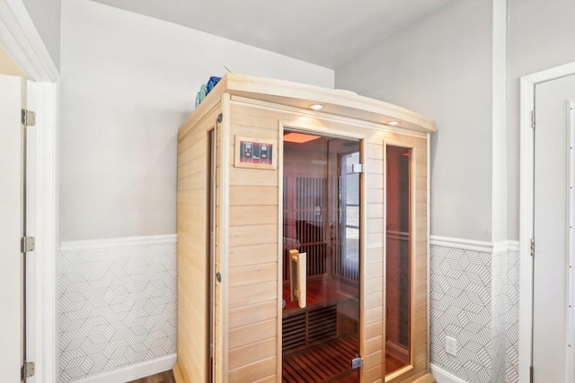 view of sauna with baseboards and tile patterned floors