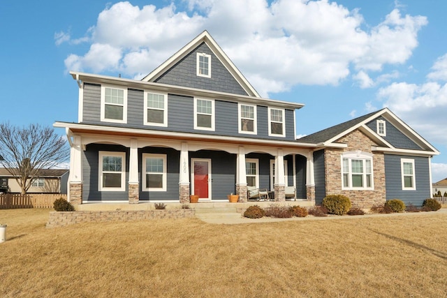 craftsman house featuring a porch and a front yard