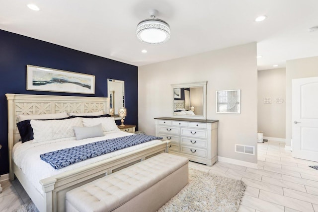 bedroom featuring baseboards, visible vents, and recessed lighting