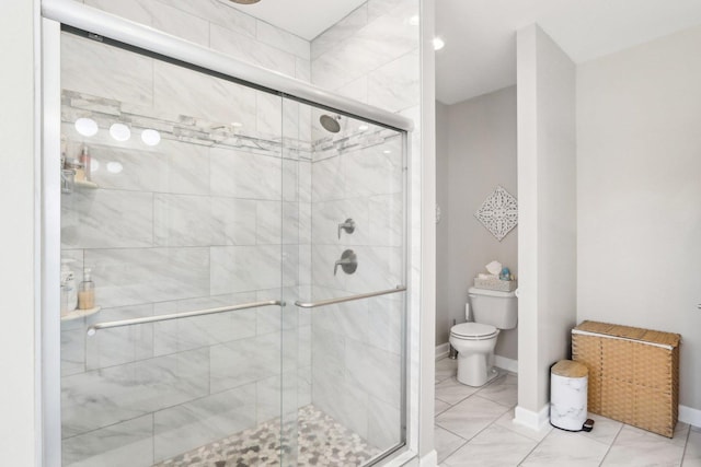 bathroom with an enclosed shower and toilet