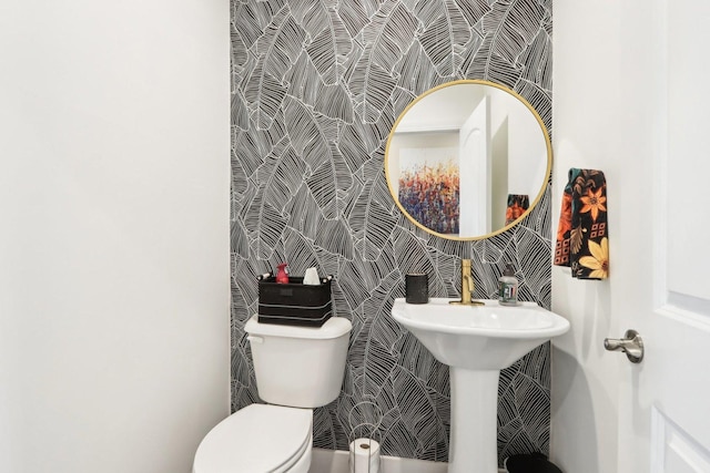 bathroom featuring sink and toilet