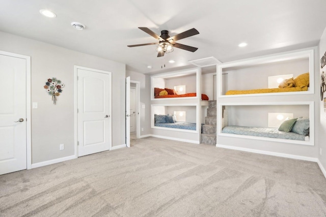 unfurnished bedroom with light carpet and ceiling fan