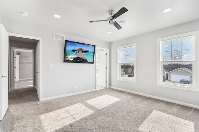 interior space featuring a ceiling fan, recessed lighting, visible vents, and baseboards