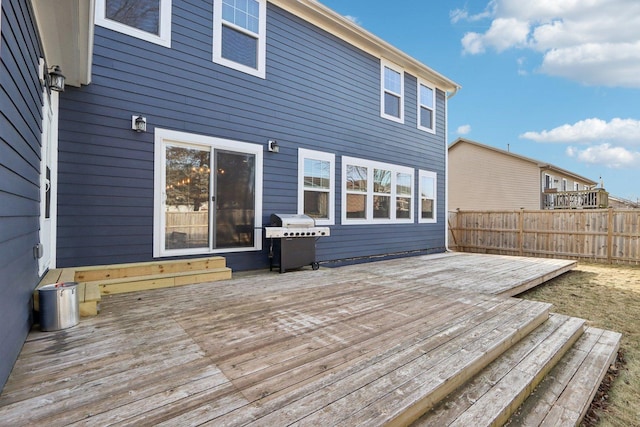 deck featuring a grill and fence