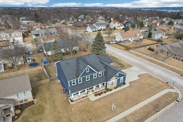 birds eye view of property with a residential view