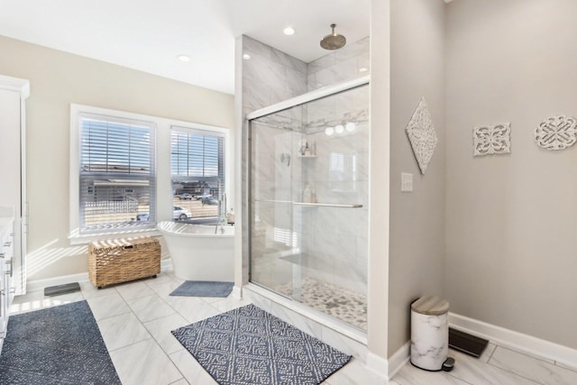 full bath with a freestanding tub, recessed lighting, visible vents, baseboards, and a shower stall