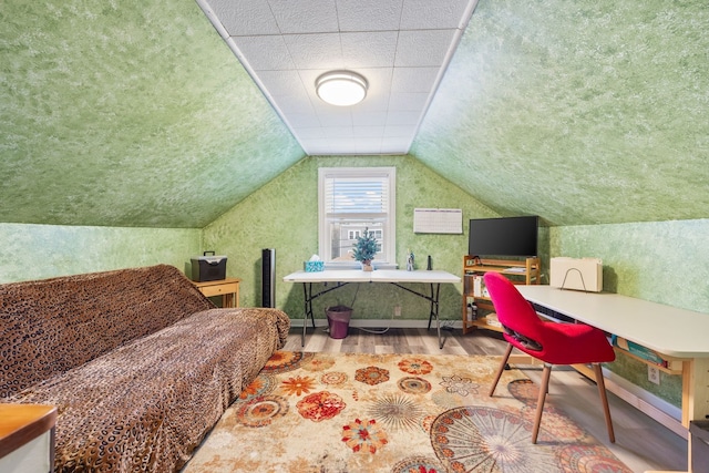 bedroom featuring wood-type flooring and lofted ceiling