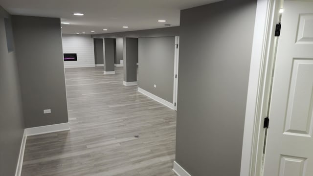 hallway with light wood-type flooring