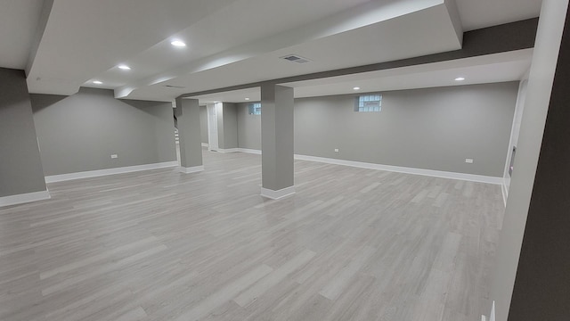 basement featuring light hardwood / wood-style flooring