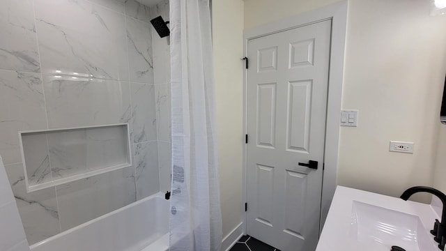 bathroom with tile patterned flooring, vanity, and shower / bath combo with shower curtain