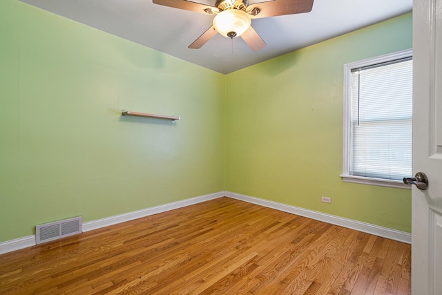 empty room featuring ceiling fan and light hardwood / wood-style floors