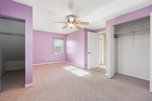 unfurnished bedroom featuring light colored carpet, ceiling fan, and a closet