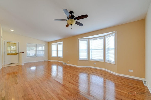 interior space featuring lofted ceiling, ceiling fan, and light wood-type flooring